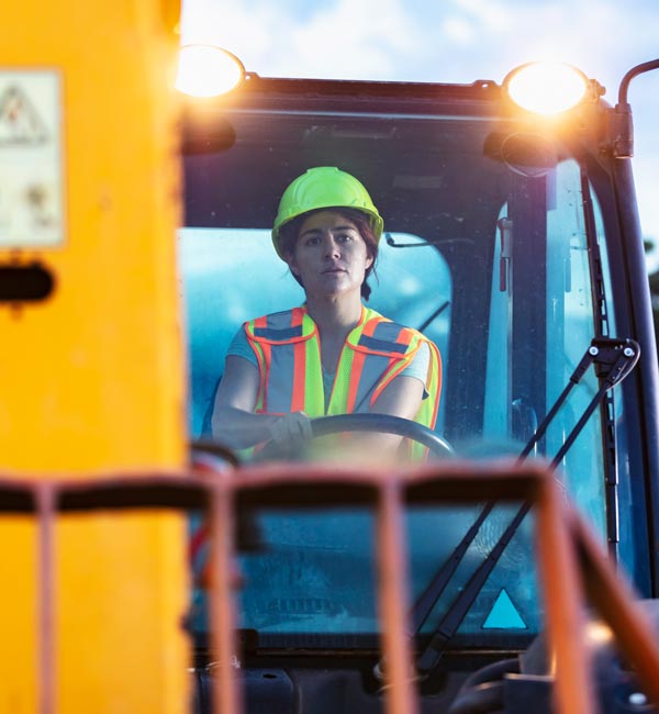 woman using telehandler