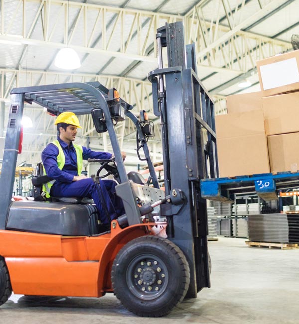 man driving forklift